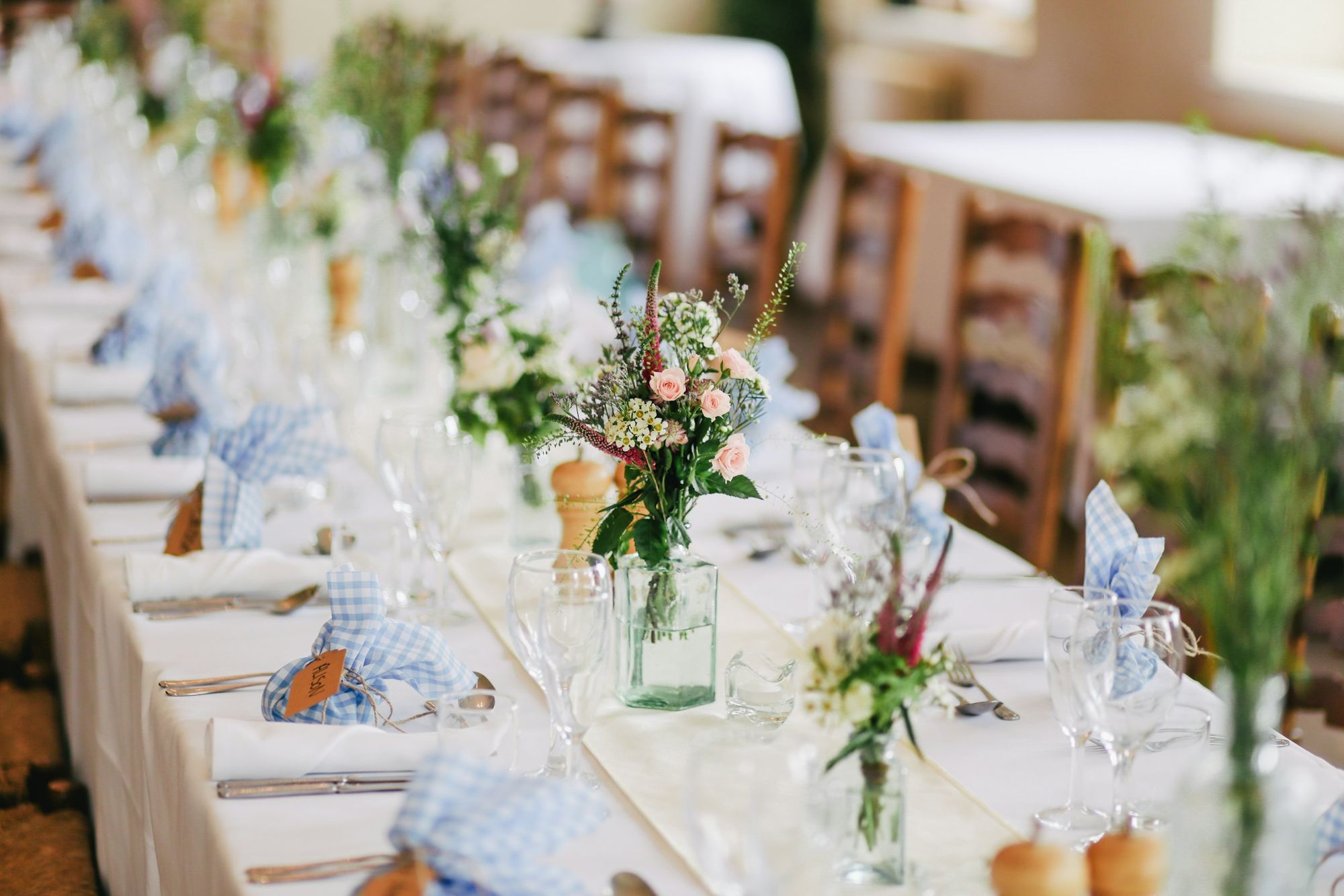 The Garden Table: a long table set with wildflowers, glassware and blue linen